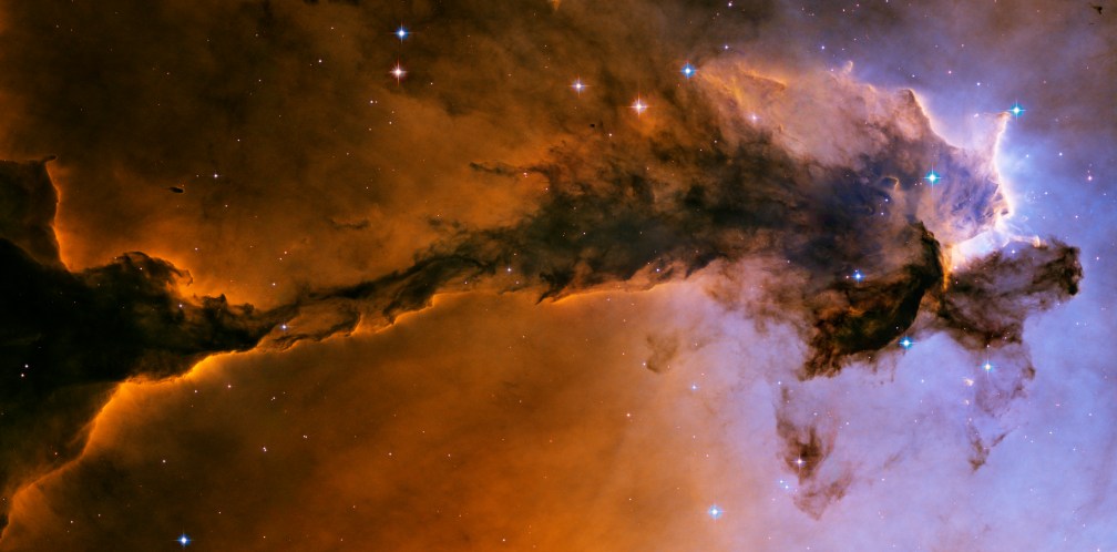 The stellar spire inside the Eagle Nebula. I've rotated it on its side, but would be seen vertically from Earth.